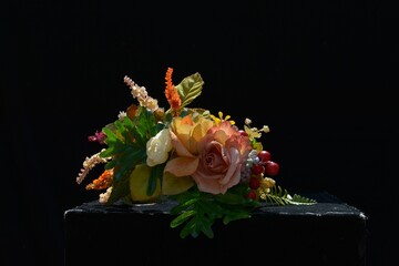 flowers and berries on a black background