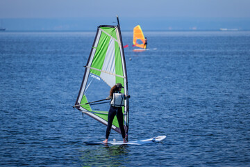 Naklejka premium Windsurfing on the bay on the Hel Peninsula in the Baltic Sea 2.06.2024