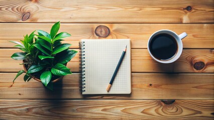Organized wooden desk setup with notebook, coffee cup, and lush green plant, symbolizing clarity, focus, and productive goal planning.