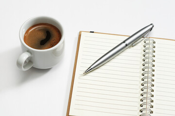 Notebook, pen and coffee