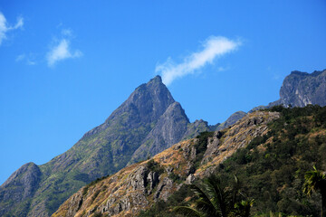 amazing mountain peak in the blue background sky with cloud 