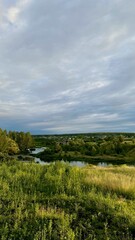 Obraz premium Perfect spring scene and morning meadow near the river with aloe tree on the shore. Location place river Europe. Photo wallpaper.