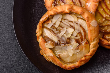 Delicious sweet crispy galettes with fruits and cinnamon