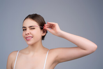 Mascara eyebrows. Natural beauty brows. Eyebrows coloring and lamination. Woman combing eyebrows....
