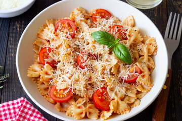 Farfalle pasta with tomatoes and cheese. Healthy eating. Vegetarian food.