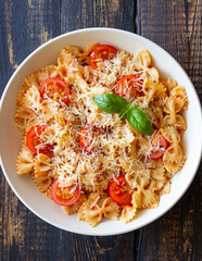 Farfalle pasta with tomatoes and cheese. Healthy eating. Vegetarian food.