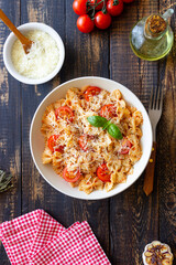 Farfalle pasta with tomatoes and cheese. Healthy eating. Vegetarian food.