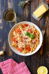 Farfalle pasta with tomatoes and cheese. Healthy eating. Vegetarian food.
