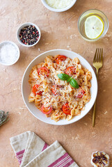 Farfalle pasta with tomatoes and cheese. Healthy eating. Vegetarian food.