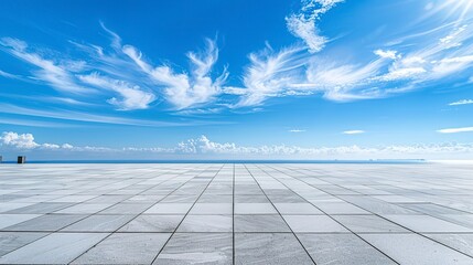 Empty landscape background with white concrete ground tiling under blue sky on a sunny day