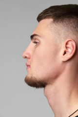Fototapeta premium Profile Portrait of Young Man With Short Hair and Goatee