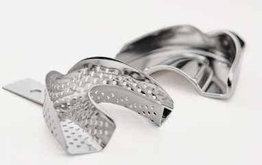 Basic orthodontic dentist tools on white background.