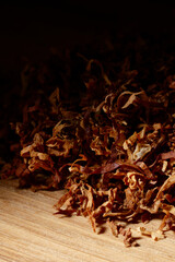 Dried cutted tobacco leaves. Textured abstract background.
