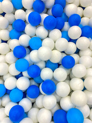 blue and white balls in a playground pool