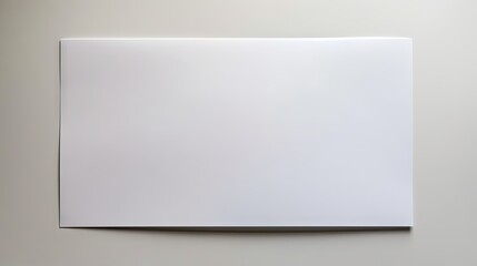 Fototapeta premium A sheet of white paper against a white backdrop, providing ample copy space image