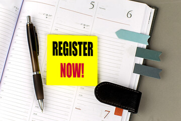 REGISTER NOW text sticky on dairy on gray background