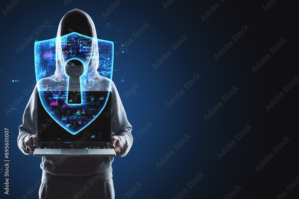 Poster hacker in hoodie holding laptop with creative glowing polygonal safety hologram on dark background w