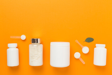 Jars with protein powder on color background, top view. Sports nutrition concept