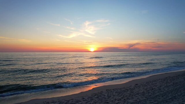 Sylt Island - Action drone flight over the sea from the beach into the sunset