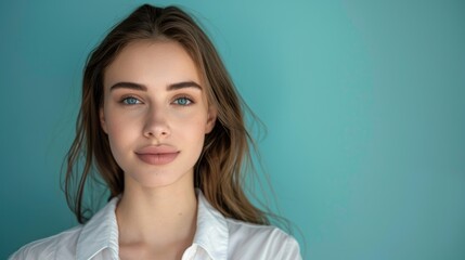 Fototapeta premium Close-up of a young, beautiful woman presenter in a headshot against a solid color background, radiating charisma and professionalism