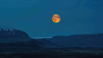 full moon at night between mountain 