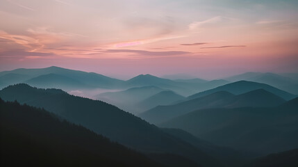 Pastel Sunset Over Layered Mountain Range. Soft pastel hues of sunset illuminate a layered mountain range, creating a tranquil and ethereal landscape scene.