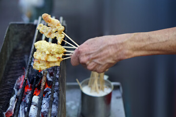 Grilled pork Satay man on the stove