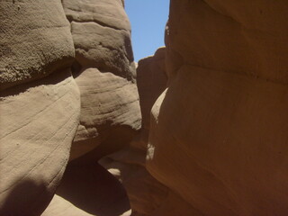 In the middle of the Sinai Colored Canyon. There are two sides of the canyon, one is in the shade, the other is sunny. Cave gorge.