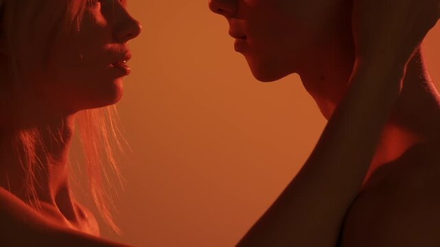 Young man and woman tender lovers faces, passion intimacy looking, hair touching, candid feelings, attraction and desire.