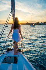 Young woman sailing, young adult lady enjoying summer travel, close-up portrait of female face,...