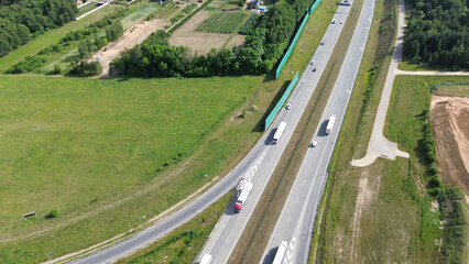 view of white semi-truck driving on countryside highway