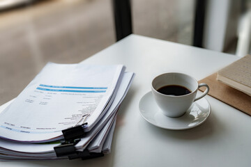 Business desk with coffee in contemporary office.