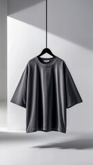 Blank black oversized t-shirt hanging on a black clothes rack, mockup