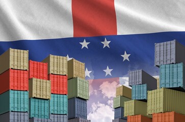 Netherlands Antilles flag and big stack of shipping cargo containers in docks with sky background close up