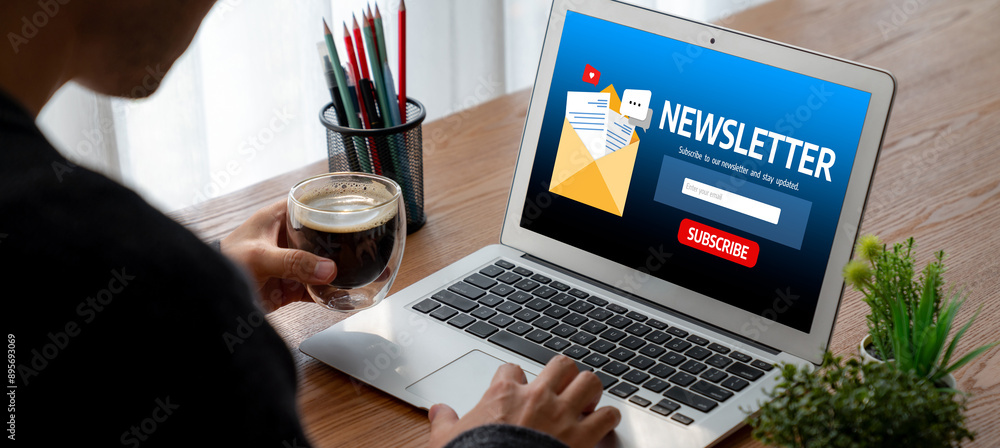 Poster newsletter signup page on computer for customer to subscribe snugly newsletter update information to