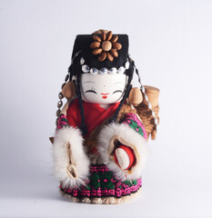 Chinese ethnic minority female doll in white background.