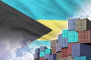 Bahamas flag and big stack of shipping cargo containers in docks with sky background close up