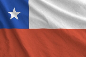 Chile flag depicted on folded wavy fabric of old cloth close up