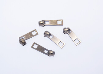 Metal zipper slider or zipper puller, isolated on white.
