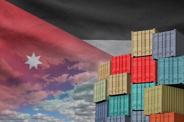 Jordan flag and big stack of shipping cargo containers in docks with sky background close up