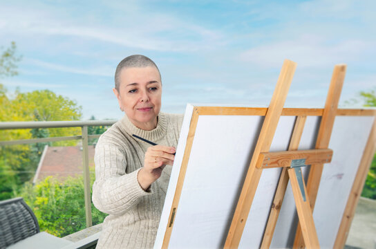 A Brush with Tranquility: Woman Undergoing Cancer Treatment Turns to Painting on Her Balcony to Combat Depression.