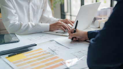 Interior architect or engineer working on computer in coworking space