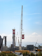 Hydrogen Refinery Under Construction with Prominent Chimney in the Foreground