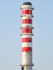 Hydrogen Refinery Under Construction with Prominent Chimney in the Foreground