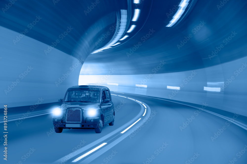 Wall mural highway road tunnel with typical black british taxi cab