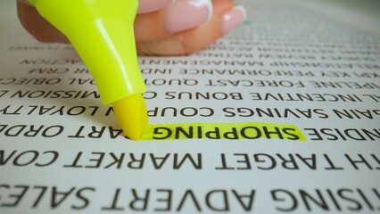 Close up shot of woman hand working with document, yellow marker in female hand marked highlighted...