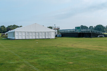 Marquee or gazebos in a field for cover at event.