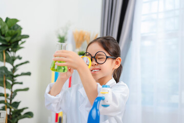 Naklejka premium young Asia girl Scientist Conducting Experiment With Microscope In Laboratory