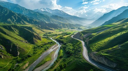 Aerial view of a beautiful road winding along a river in the Caucasus Mountains of Georgia, with Alpine scenery