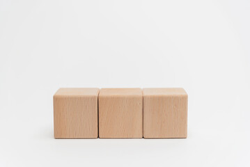 Obraz premium Wooden Blocks Arranged In Ascending Order On White Background